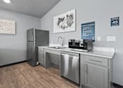 Thumbnail 53 of 53 - A kitchen with stainless steel appliances and a wooden floor.