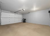 Thumbnail 26 of 34 - A large empty room with a trash can in the middle.