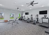 Thumbnail 36 of 53 - A spacious home gym with a variety of exercise equipment.