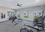 Thumbnail 41 of 53 - A spacious home gym with a variety of exercise equipment.