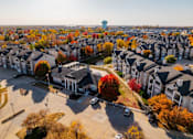 Thumbnail 41 of 51 - an aerial view of a neighborhood with houses and trees at 92West, West Des Moines  
