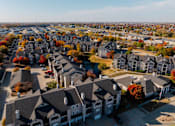 Thumbnail 43 of 51 - an aerial view of a neighborhood with houses and trees at 92West, West Des Moines  