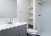 Thumbnail 41 of 57 - A white bathroom with a toilet and sink. at Bristol Ridge, Urbandale, 50322