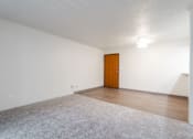 Thumbnail 48 of 57 - A room with a carpeted floor and a wooden door. at Bristol Ridge, Urbandale, IA, 50322