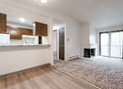 Thumbnail 28 of 57 - A living room with a fireplace and sliding glass doors. at Bristol Ridge, Urbandale, 50322