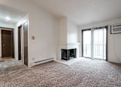 Thumbnail 35 of 57 - A living room with a fireplace and a carpet. at Bristol Ridge, Urbandale, IA