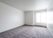 Thumbnail 31 of 57 - A room with a carpeted floor and a window. at Bristol Ridge, Urbandale, 50322