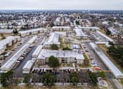 Thumbnail 56 of 57 - parking lot is surrounded by apartment buildings. at Bristol Ridge, Iowa