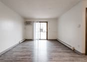 Thumbnail 13 of 57 - A large empty room with a doorway leading to another room. at Bristol Ridge, Urbandale, Iowa