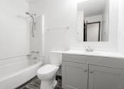 Thumbnail 8 of 57 - A white bathroom with a toilet, sink, and bathtub. at Bristol Ridge, Urbandale