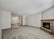 Thumbnail 19 of 33 - a living room with a fireplace and a carpeted floor at Creekstone Falls, South Dakota, 57106