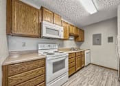 Thumbnail 31 of 33 - a view of the ceiling of a room with wood cabinets at Creekstone Falls, South Dakota
