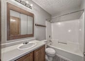 Thumbnail 24 of 33 - a bathroom with a sink and a toilet and a shower at Creekstone Falls, Sioux Falls, South Dakota