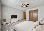 Thumbnail 6 of 33 - a bedroom with a bed and a ceiling fan at Creekstone Falls, Sioux Falls, SD