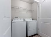 Thumbnail 4 of 30 - A white laundry room with a washer and dryer. at Danamere Village, Carlisle, Iowa