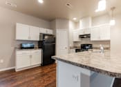 Thumbnail 15 of 30 - Island Kitchen at Danamere Village, Iowa, 50047