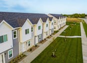 Thumbnail 40 of 42 - a row of small white houses with green grass at Forge65, Iowa, 50327