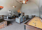 Thumbnail 40 of 66 - A room with a pool table and a shag carpet.