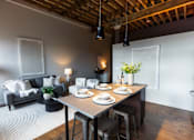 Thumbnail 14 of 99 - A dining area with a table set for two.at Plant 1 Lofts, N. Newton, IA 50208  