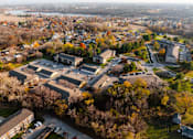 Thumbnail 79 of 90 - An aerial view of a residential area with houses and trees. at Rosemont Place Apartments, Des Moines, IA