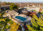 Thumbnail 71 of 90 - A red truck is parked by a pool in a residential area. at Rosemont Place Apartments, Iowa, 50320