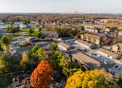 Thumbnail 63 of 90 - A view of a residential area with houses and trees at Rosemont Place Apartments, Iowa