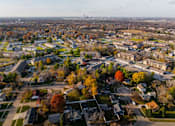 Thumbnail 90 of 90 - A bird's eye view of a residential area with houses and trees at Rosemont Place Apartments, Des Moines, IA