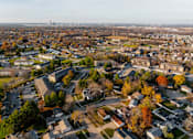 Thumbnail 60 of 90 - A suburban neighborhood with a mix of residential and commercial buildings. at Rosemont Place Apartments, Des Moines