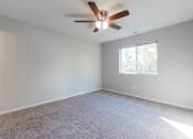 Thumbnail 18 of 42 - A room with a ceiling fan and a window. at Saylorville Lakeside, Polk City, IA, 50226