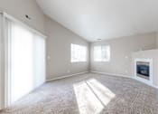 Thumbnail 17 of 42 - A sunny room with a carpet, a fireplace, and a window. at Saylorville Lakeside, Polk City, 50226