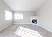 Thumbnail 25 of 42 - A sunny room with a fireplace and carpet. at Saylorville Lakeside, Iowa