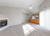 Thumbnail 15 of 42 - A spacious living room with a fireplace and a carpeted floor. at Saylorville Lakeside, Polk City, 50226