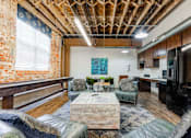Thumbnail 11 of 25 - A room with a wooden ceiling at Spaulding Lofts Apartments, Grinnell, Iowa