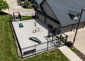 Thumbnail 60 of 60 - A black metal fence surrounds a green and white sandbox.