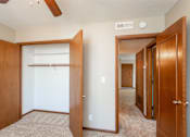 Thumbnail 5 of 13 - the view of a bedroom with a closet and a mirrored closet door at Lake Shore Place Apartments, Ankeny, IA,  50021