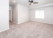 Thumbnail 41 of 56 - room with ceiling fan and window at Meadowlark Place Apartments, Grimes, IA