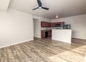 Thumbnail 38 of 56 - A room with a ceiling fan and wooden flooring at Meadowlark Place Apartments, Grimes