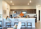 Thumbnail 1 of 69 - a family in the kitchen of a modern house at Converge NW, Waukee, IA  