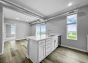 Thumbnail 30 of 69 - a white kitchen with a sink and a window at Converge NW, Waukee, IA 50263  