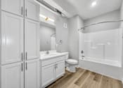 Thumbnail 46 of 69 - a bathroom with white cabinets and a toilet and a shower at Converge NW, Waukee, 50263  
