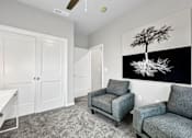 Thumbnail 20 of 69 - a living room with two chairs and a table at Converge NW, Waukee Iowa  