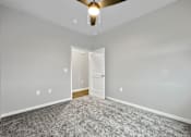 Thumbnail 22 of 69 - an empty room with carpet and a ceiling fan at Converge NW, Waukee Iowa  
