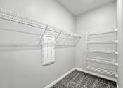 Thumbnail 21 of 69 - the spacious closet in the bedroom of a home with mirrored closets and a closet at Converge NW, Iowa  