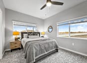 Thumbnail 19 of 69 - a bedroom with a bed and a ceiling fan at Converge NW, Waukee, 50263  