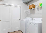 Thumbnail 7 of 69 - a white washer and dryer in a laundry room with white doors at Converge NW, Waukee  