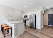 Thumbnail 39 of 69 - A kitchen with a white counter top and a refrigerator.at Converge NW, Iowa, 50263