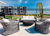 Thumbnail 62 of 69 - a lounge area with couches and chairs outside of a building at Converge NW, Waukee Iowa  