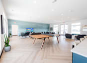 Thumbnail 60 of 69 - a living room with a wooden floor and a table and chairs at Converge NW, Iowa  