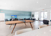 Thumbnail 61 of 69 - a large living room with a table and chairs at Converge NW, Iowa  