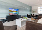 Thumbnail 53 of 69 - a living room with couches and chairs and a tv on the wall at Converge NW, Iowa, 50263